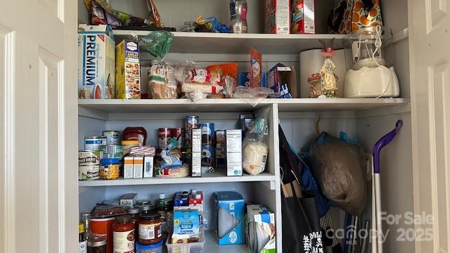 109 Delmar Road Shelby, NC 28152 - Photo 3 of 16 a utility room with lots of clutter and cabinets