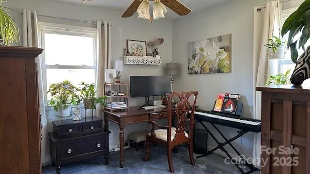 a work room with furniture and a window