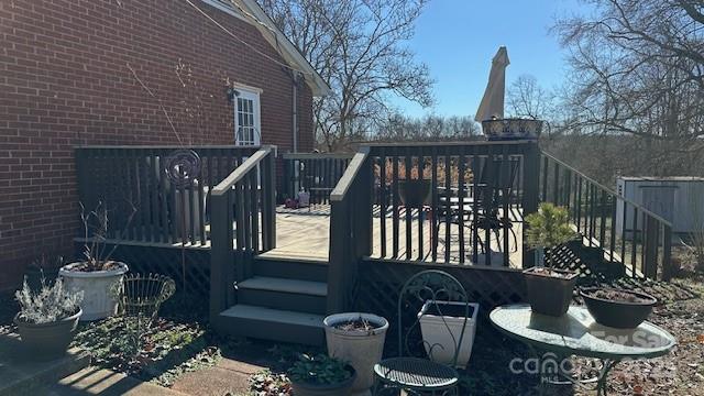 109 Delmar Road Shelby, NC 28152 - Photo 10 of 16 a view of a balcony with chairs and potted plants
