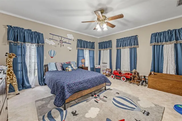 a bed room with a bed and a chandelier