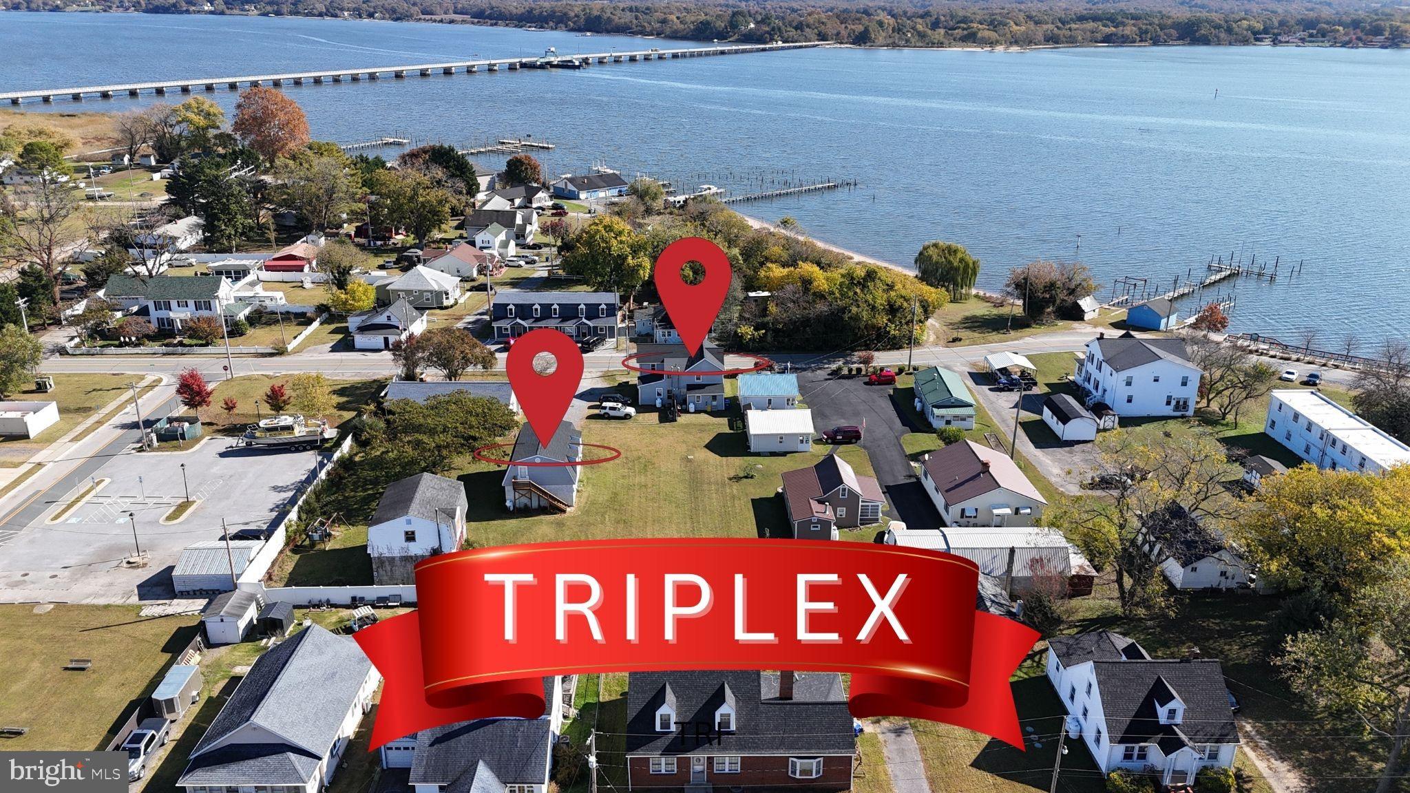 Scenic triplex near serene waterfront.