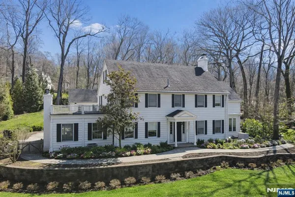 a view of house with yard and green space
