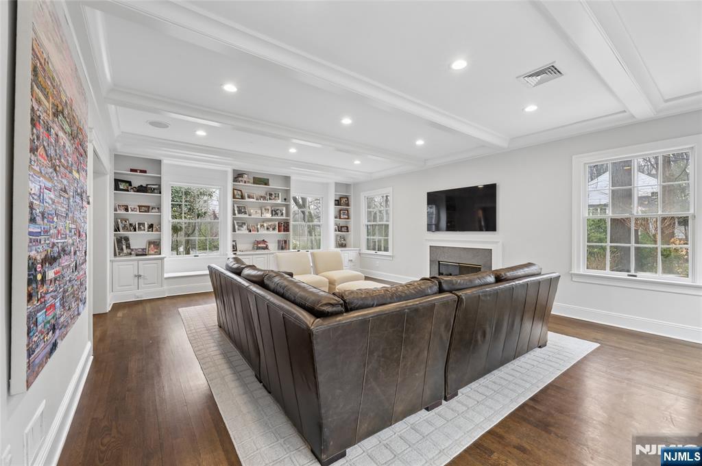14 Old Smith Road Tenafly, NJ 07670 - Photo 11 of 50 a living room with furniture and a flat screen tv