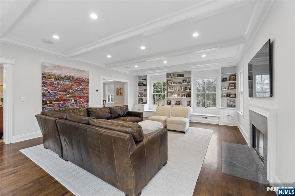 14 Old Smith Road Tenafly, NJ 07670 - Photo 12 of 50 a living room with furniture a fireplace and a large window