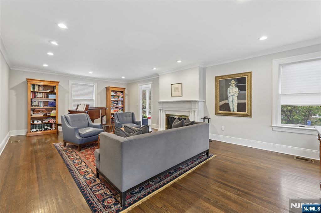 14 Old Smith Road Tenafly, NJ 07670 - Photo 13 of 50 a living room with furniture a flat screen tv and a fireplace