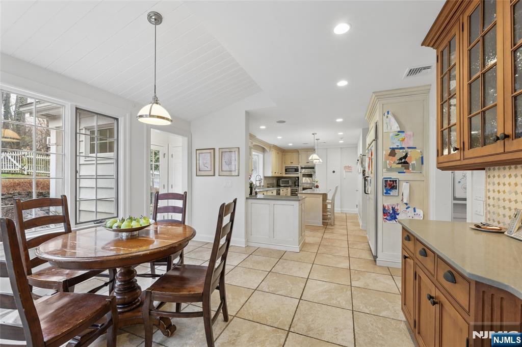 14 Old Smith Road Tenafly, NJ 07670 - Photo 22 of 50 a view of a dining room and livingroom with furniture wooden floor a chandelier
