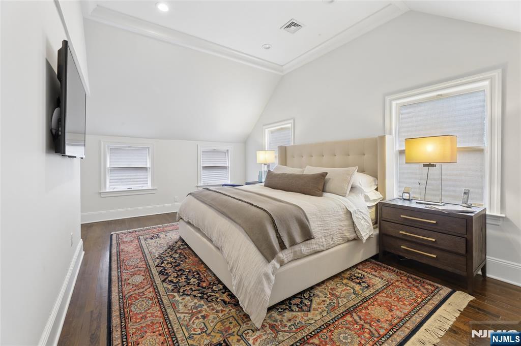 14 Old Smith Road Tenafly, NJ 07670 - Photo 28 of 50 a bedroom with a bed and a lamp on dresser