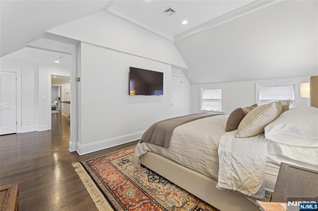 14 Old Smith Road Tenafly, NJ 07670 - Photo 29 of 50 a bedroom with a bed and a flat screen tv