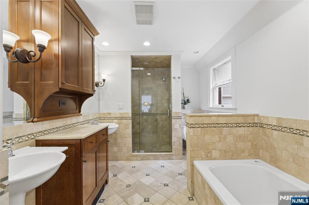 14 Old Smith Road Tenafly, NJ 07670 - Photo 31 of 50 a bathroom with a granite countertop sink a toilet and shower