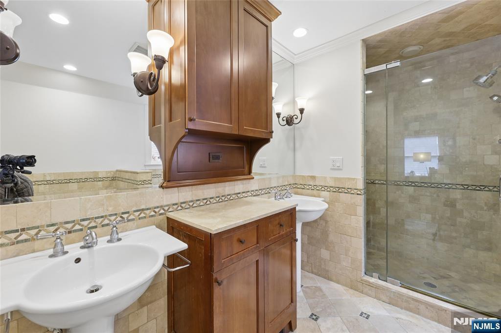 14 Old Smith Road Tenafly, NJ 07670 - Photo 32 of 50 a bathroom with a sink and a mirror