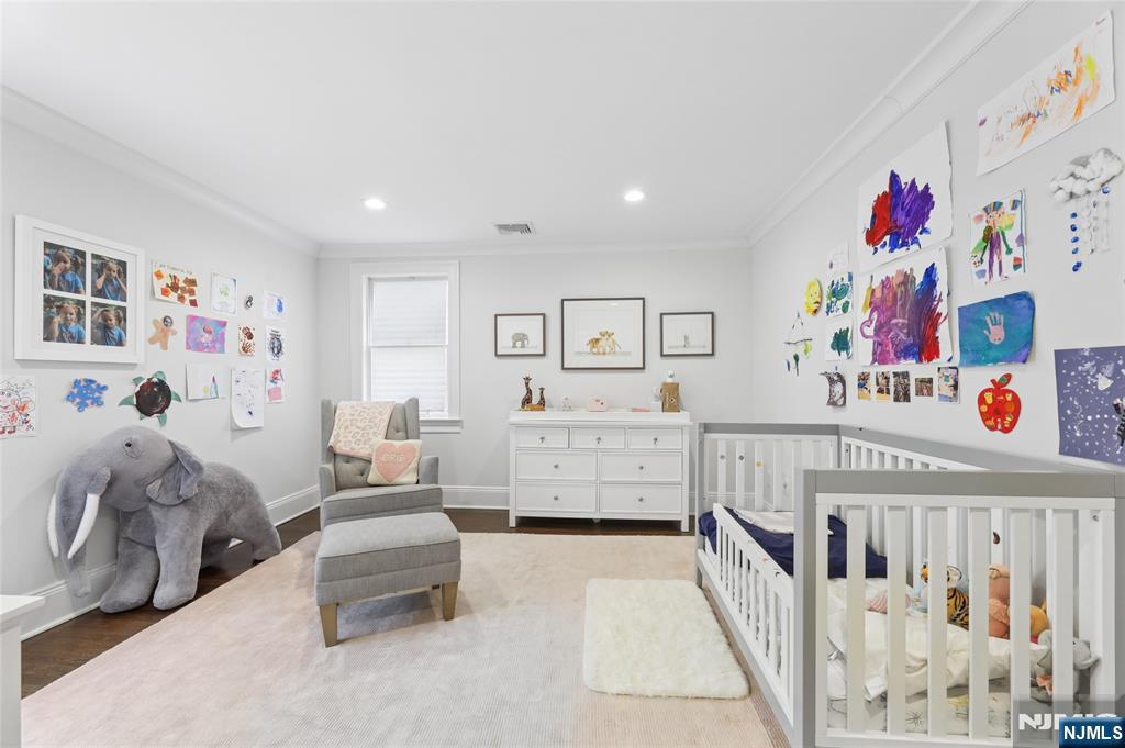 14 Old Smith Road Tenafly, NJ 07670 - Photo 33 of 50 a bedroom with furniture a baby crib and a window