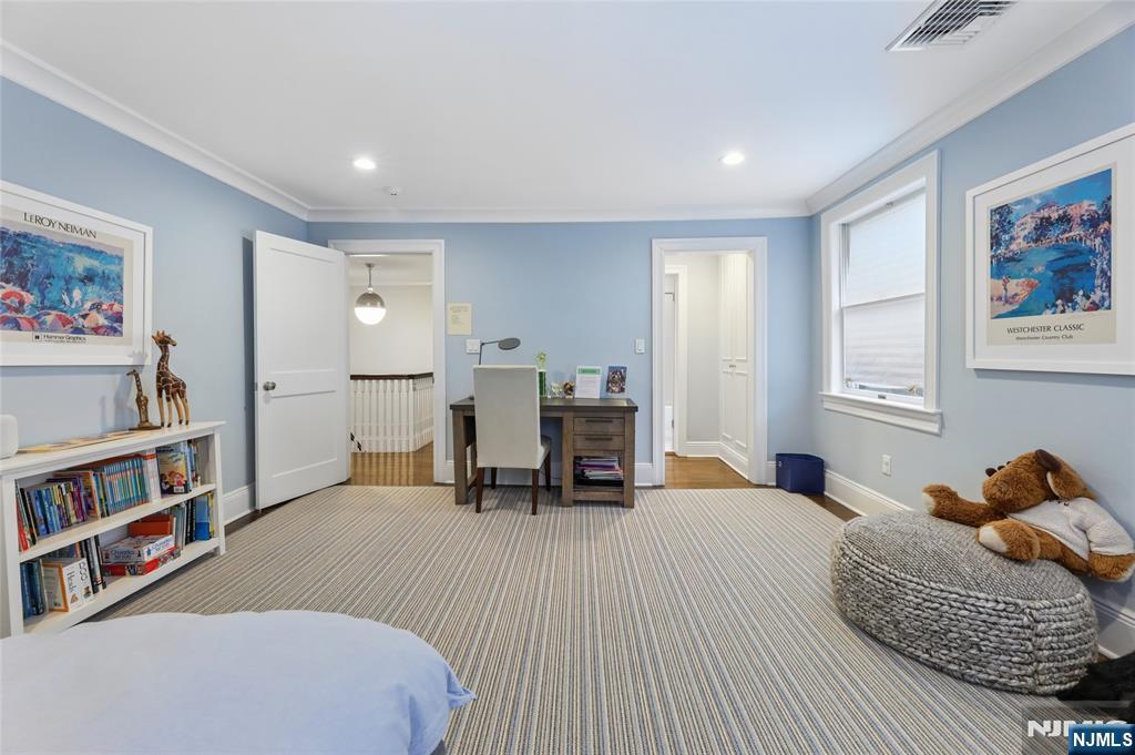 14 Old Smith Road Tenafly, NJ 07670 - Photo 38 of 50 a bedroom with furniture and a book shelf