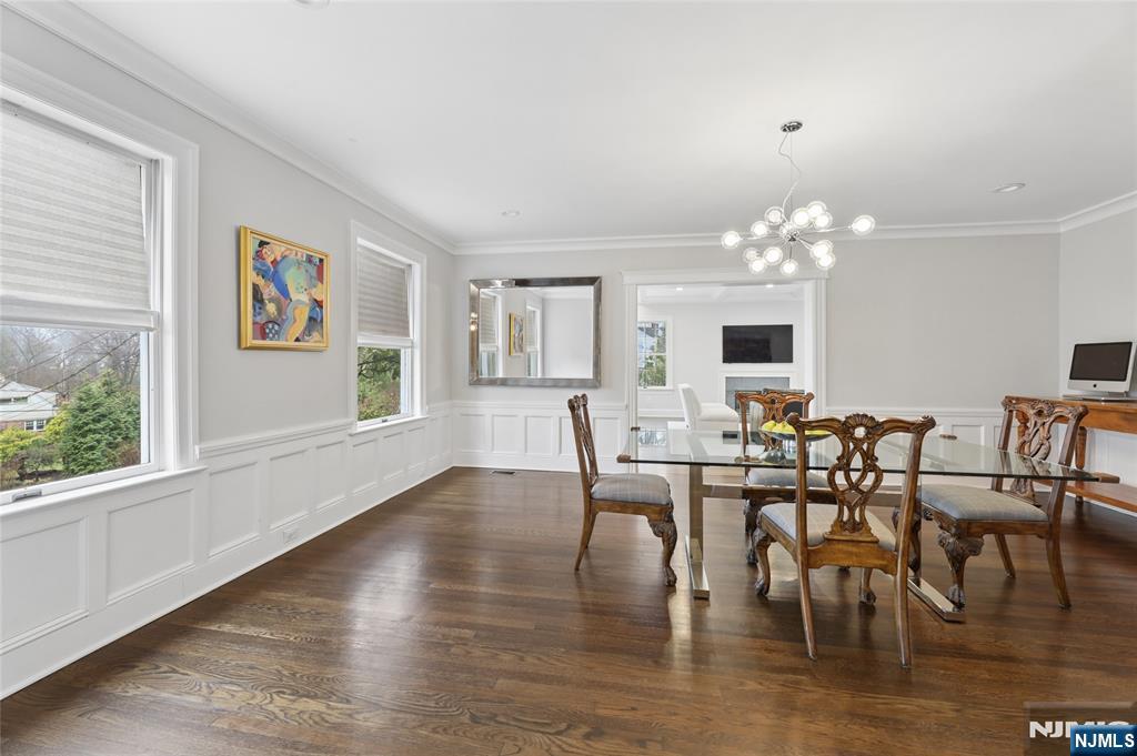 14 Old Smith Road Tenafly, NJ 07670 - Photo 6 of 50 a view of a dining room with furniture a chandelier and wooden floor