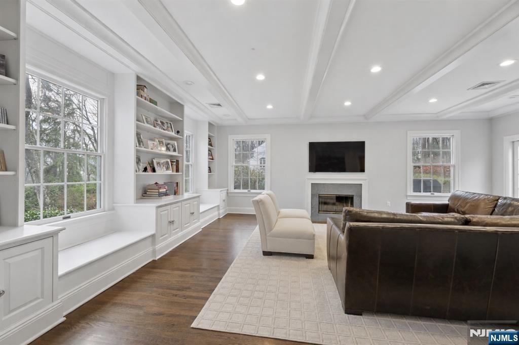 14 Old Smith Road Tenafly, NJ 07670 - Photo 9 of 50 a living room with furniture and a flat screen tv