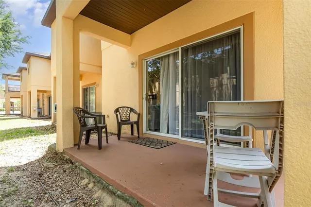 a front view of a house with outdoor seating