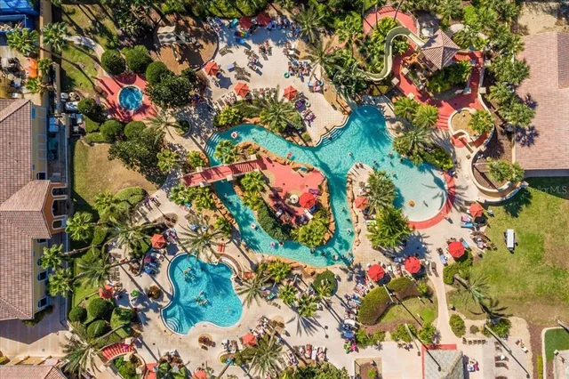 a view of a swimming pool with a patio