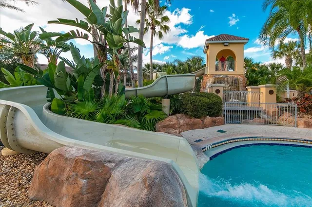 a view of a swimming pool and lounge chair