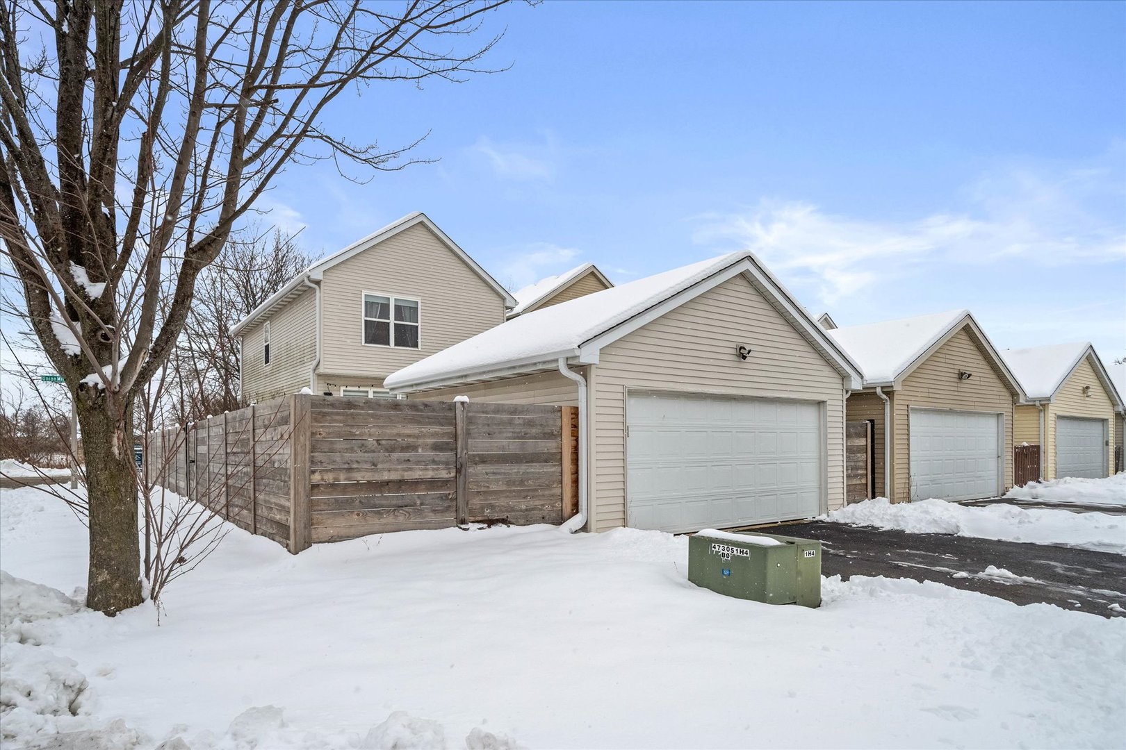 2077 Union Mill Drive Aurora, IL 60503 - Photo 17 of 18 front view of a house with a snow in the yard