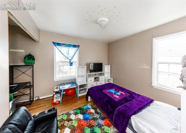 a workspace with furniture and wooden floor