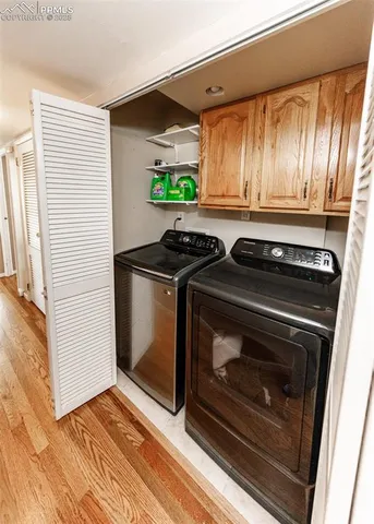a view of a livingroom with furniture and natural light