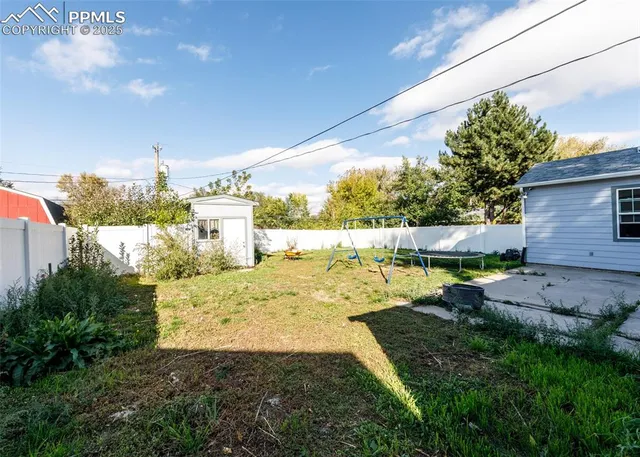 a potted plant sitting in front of a house
