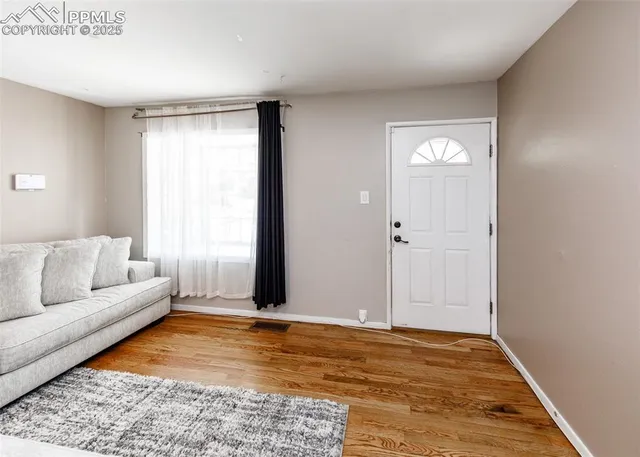 a living room with furniture and a rug