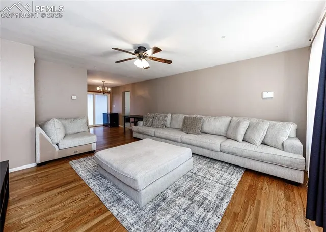 a living room with furniture and a rug