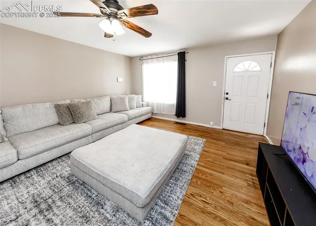 a living room with stainless steel appliances kitchen island granite countertop furniture and a kitchen view