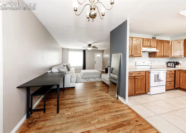 a kitchen with stainless steel appliances granite countertop a stove and a sink
