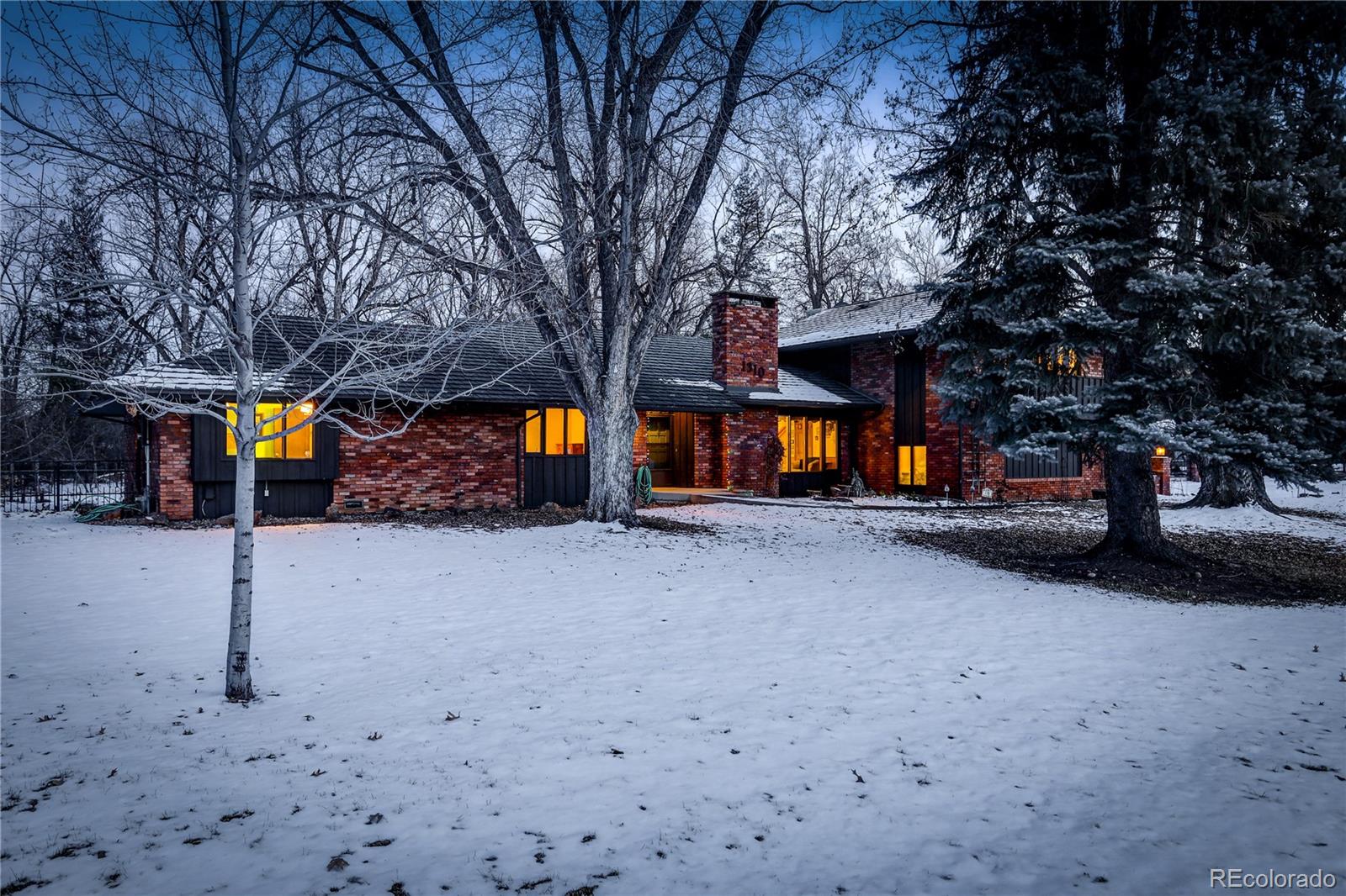 1310 Old Tale Road Boulder, CO 80303 - Photo 4 of 23 a view of a house with a yard
