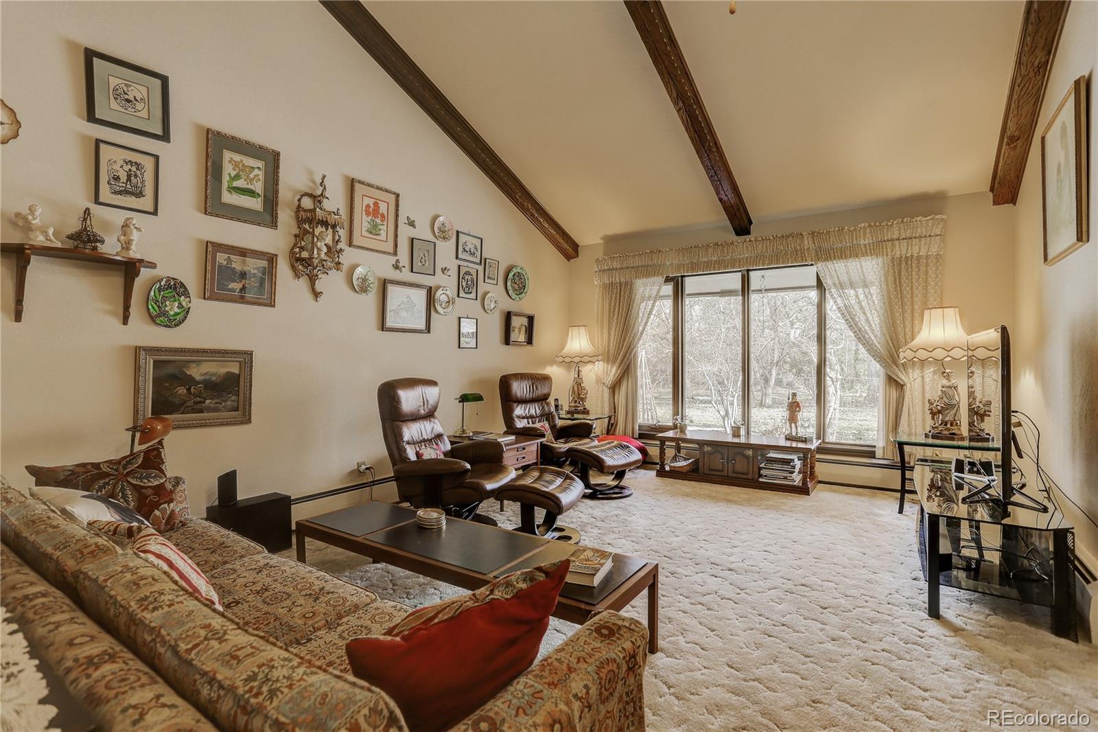 1310 Old Tale Road Boulder, CO 80303 - Photo 5 of 23 a living room with furniture and large windows