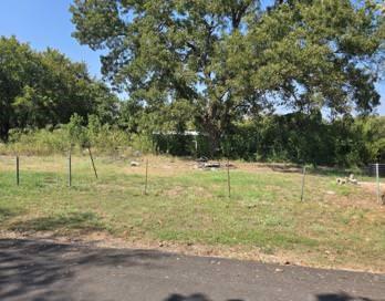 1724 Walnut Street Waco, TX 76704 - Photo 2 of 2 a view of a yard with large trees