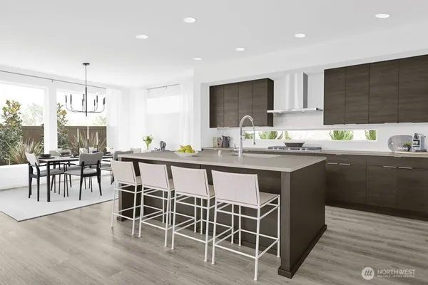 a kitchen with stainless steel appliances a sink stove and refrigerator