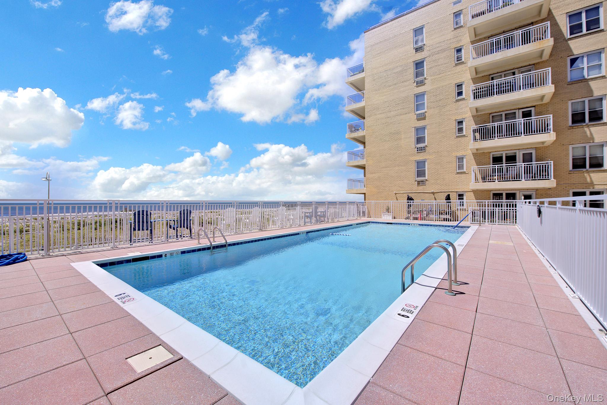 700 Shore Road, Unit 5M Long Beach, NY 11561 - Photo 25 of 34 View Of Heated Salt Water Swimming Pool..