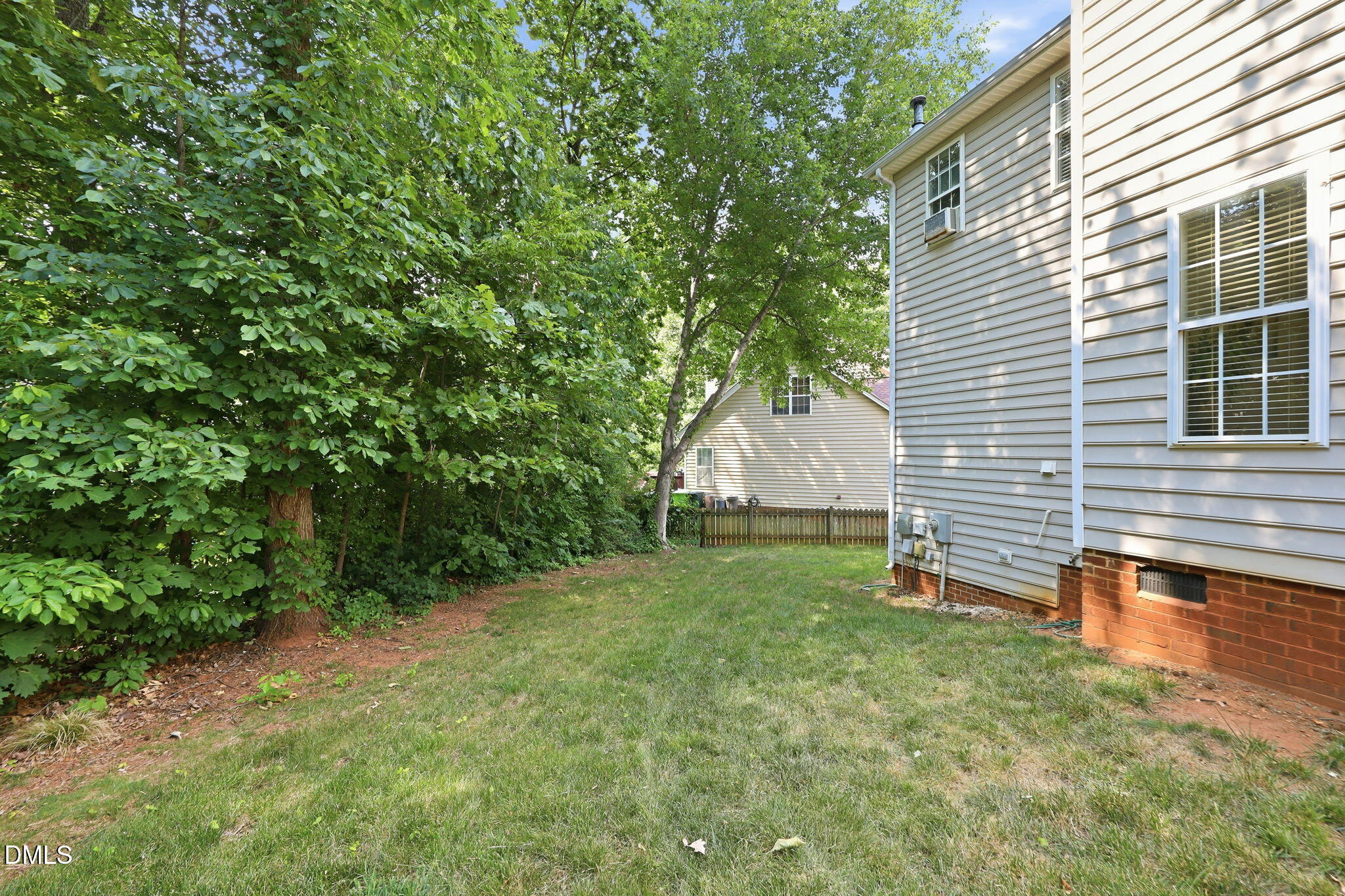 9105 Willow Valley Court Raleigh, NC 27617 - Photo 41 of 51 a view of a backyard with a garden