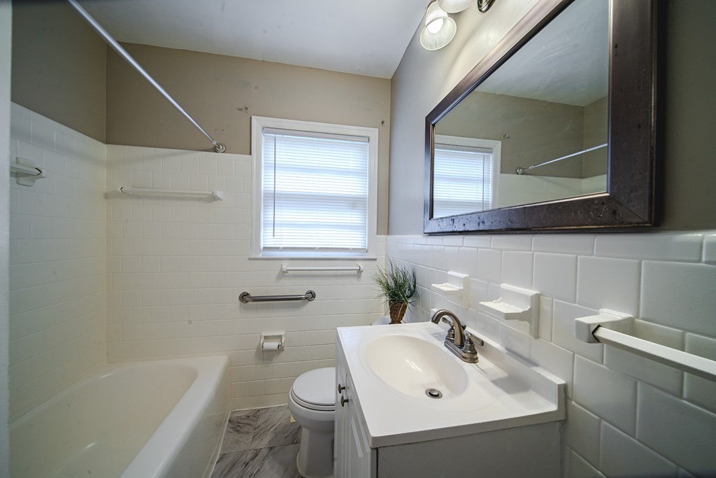 3009 Plantation Road Columbus, GA 31903 - Photo 11 of 13 a bathroom with a sink toilet and shower