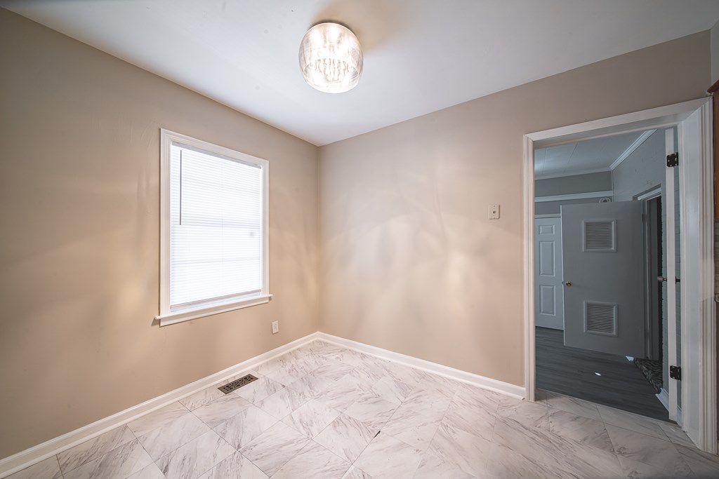 3009 Plantation Road Columbus, GA 31903 - Photo 6 of 13 an empty room with a window
