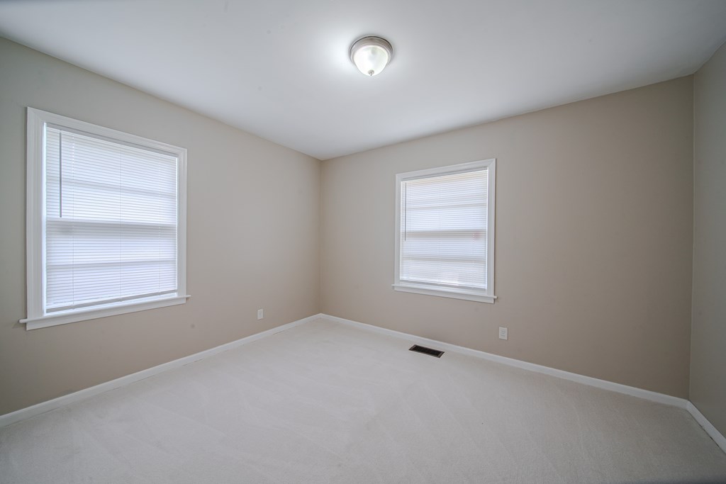 3009 Plantation Road Columbus, GA 31903 - Photo 7 of 13 an empty room with a window