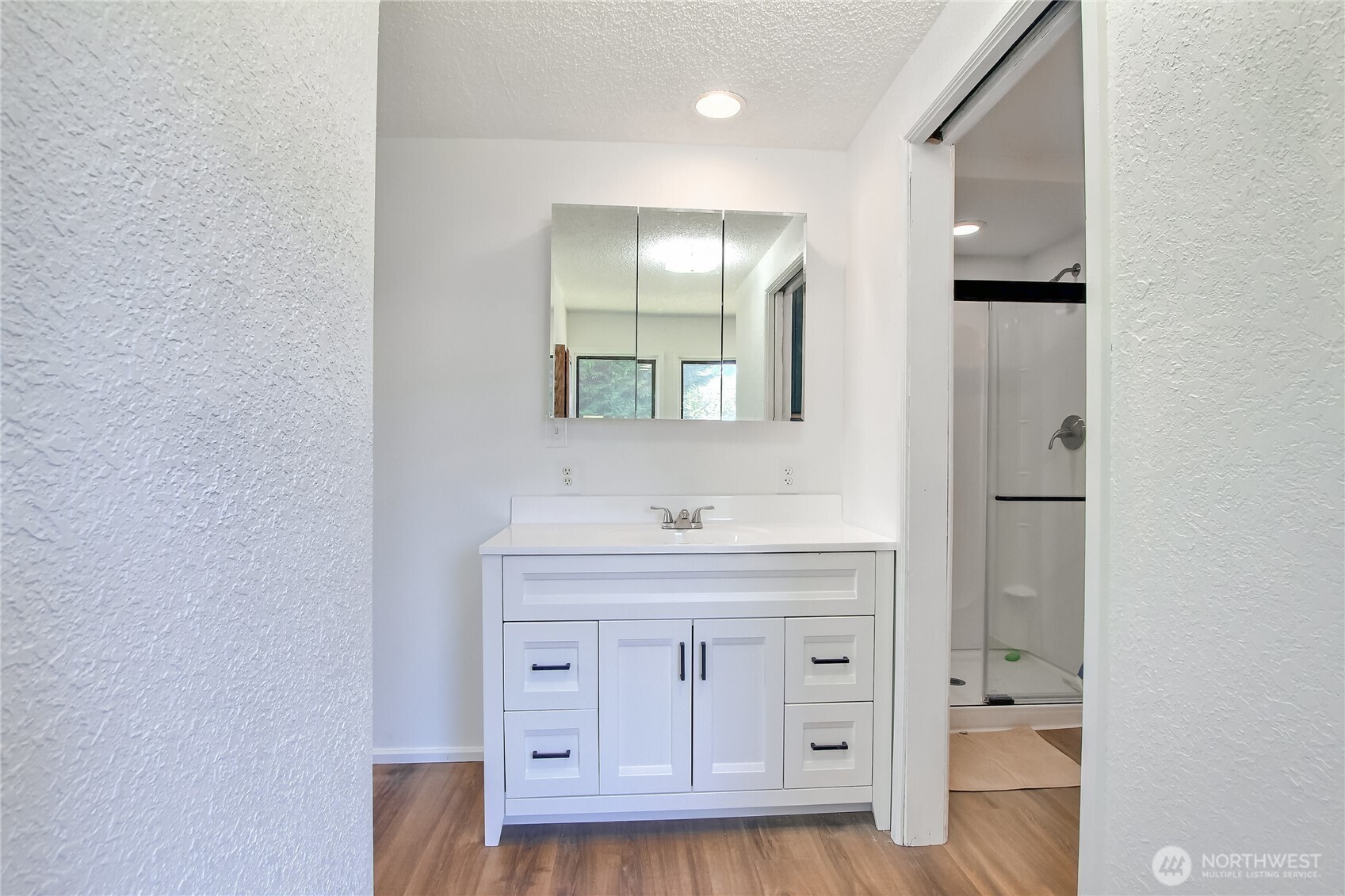 13610 Southeast 288th Street Kent, WA 98042 - Photo 10 of 32 a bathroom with a granite countertop sink a toilet and a window