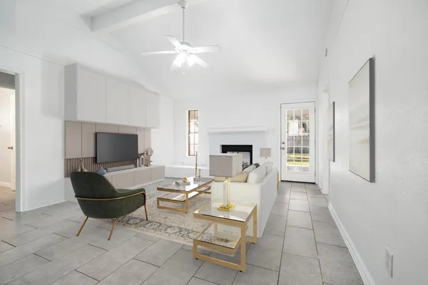 a living room with furniture and a fireplace