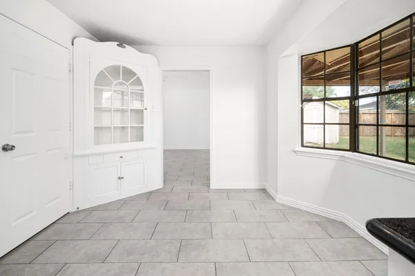 a view of an empty room with a window