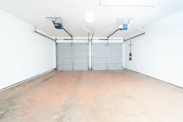 a view of house with backyard and glass windows