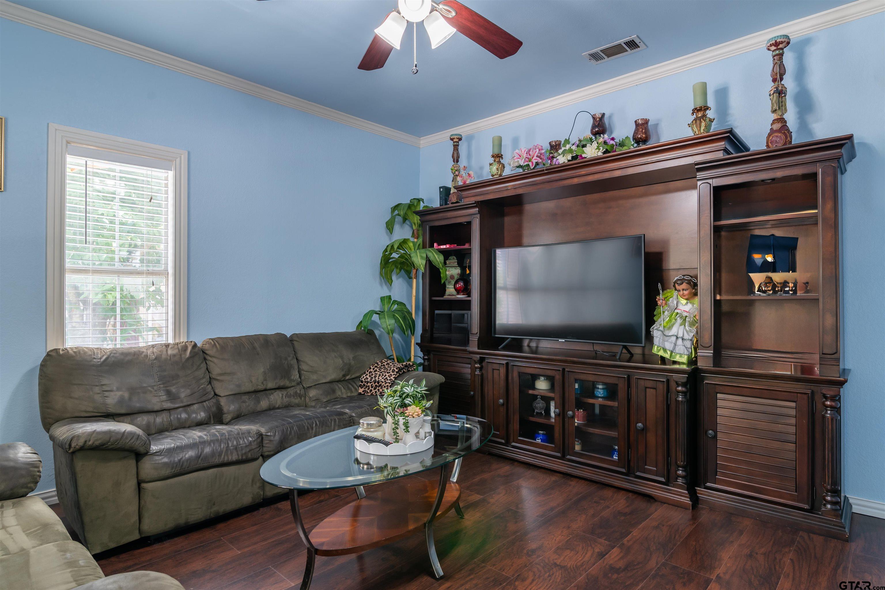 427 East Locust Street Tyler, TX 75702 - Photo 6 of 42 a living room with furniture and a flat screen tv