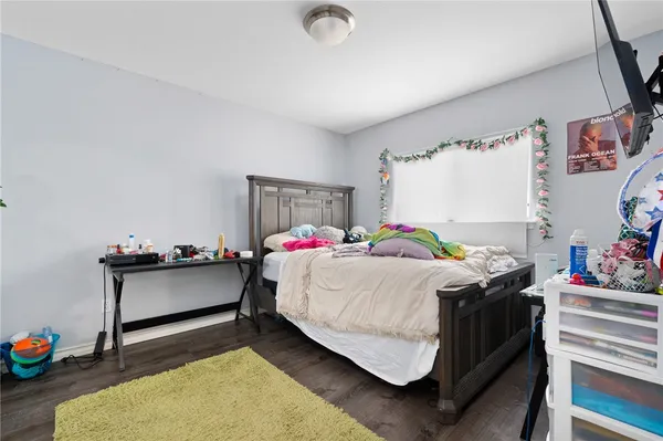 a bedroom with a bed and a dresser