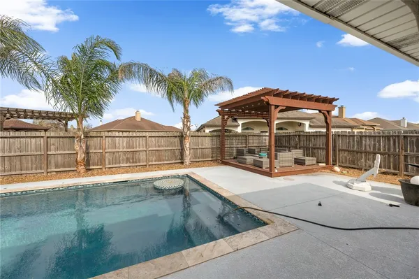 a view of multiple houses with a swimming pool