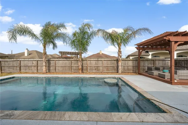 a view of outdoor space with swimming pool and lounge chair
