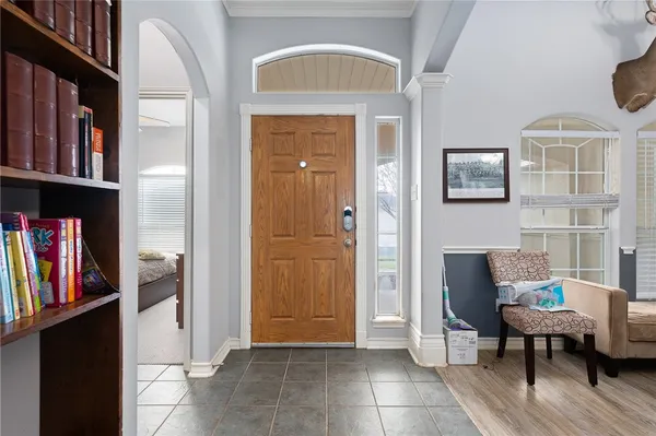 a view of room with furniture and wooden floor