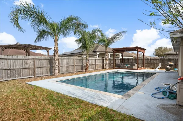 a view of a swimming pool with a patio