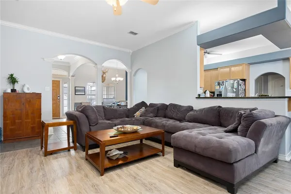a living room with furniture and a large window