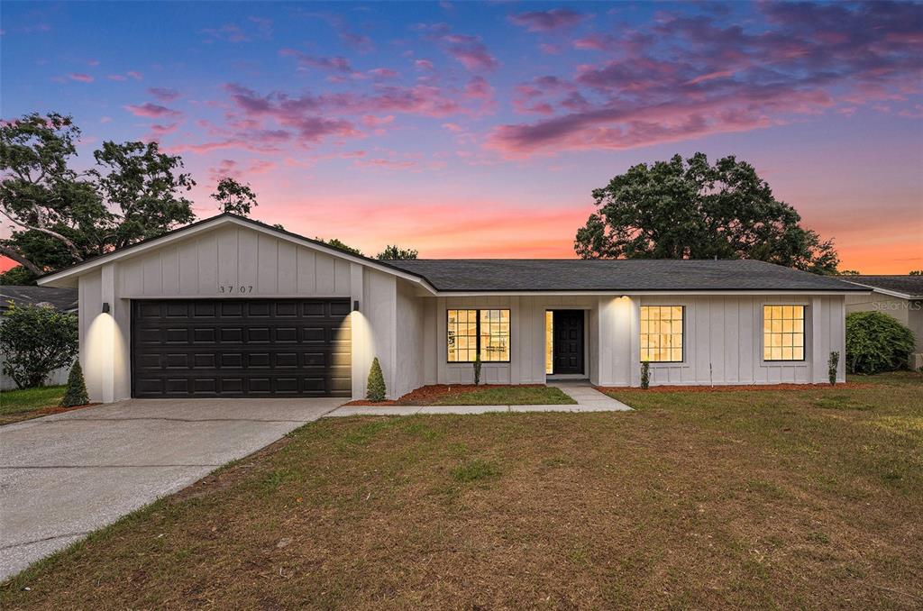 3707 Orangepointe Road Valrico, FL 33596 - Photo 1 of 1 a front view of a house with a yard and garage
